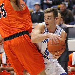 Brigham Young Cougars guard Kyle Collinsworth (5) looks to pass around Pacific Tigers center Sami Eleraky (35) as BYU and Pacific play at the Marriott Center in Provo Utah Saturday, Feb. 6, 2016. Pacific won 77-72.