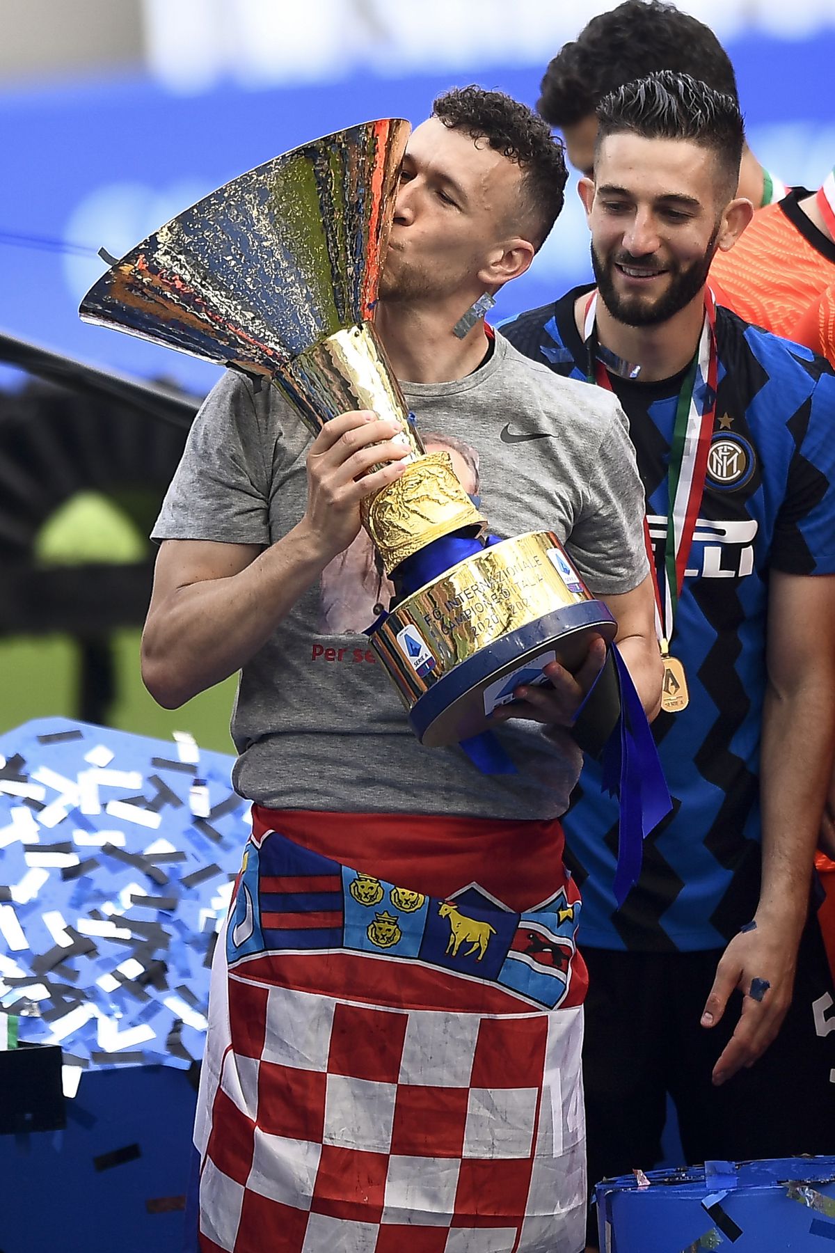 Ivan Perisic of FC Internazionale kisses the Scudetto trophy...