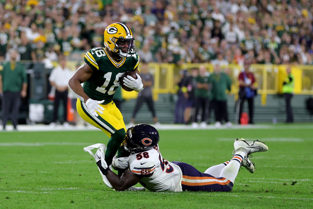Randall Cobb #18 of the Green Bay Packers is tackled by Roquan Smith #58 of the Chicago Bears d1h at Lambeau Field on September 18, 2022 in Green Bay, Wisconsin.