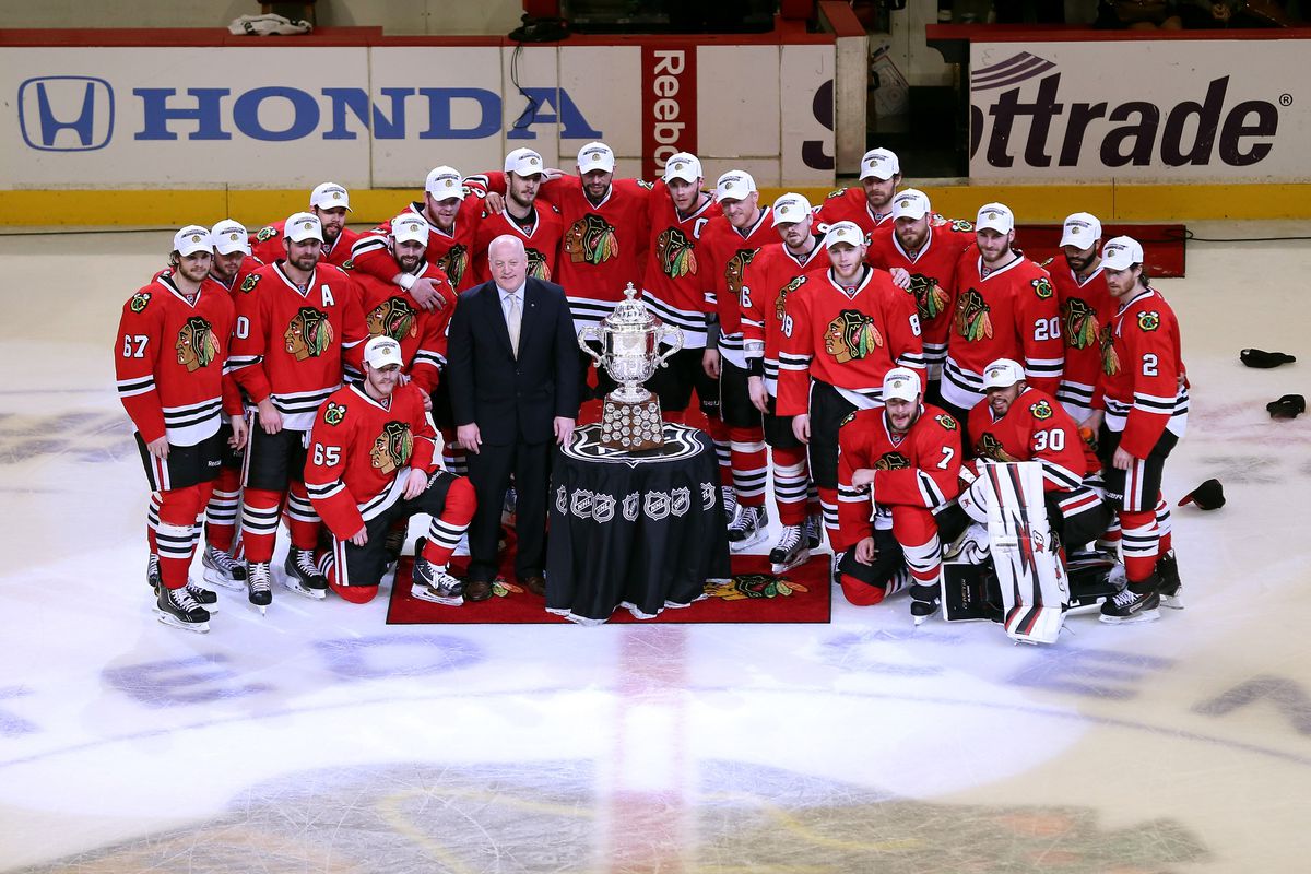 The Chicago Blackhawks pose with the Clarence S. Campbell trophy after defeating the Los Angeles Kings 4-3 in double overtime.
