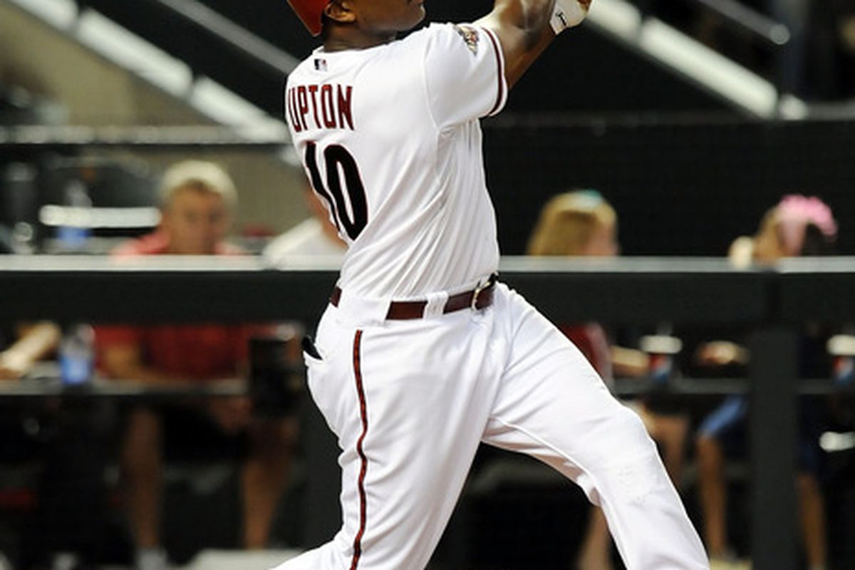 PHOENIX, AZ - JUNE 28:  Justin Upton #10 of the Arizona Diamondbacks follows through on a swing against the Cleveland Indians at Chase Field on June 28, 2011 in Phoenix, Arizona. Arizona won 6-4. (Photo by Norm Hall/Getty Images)