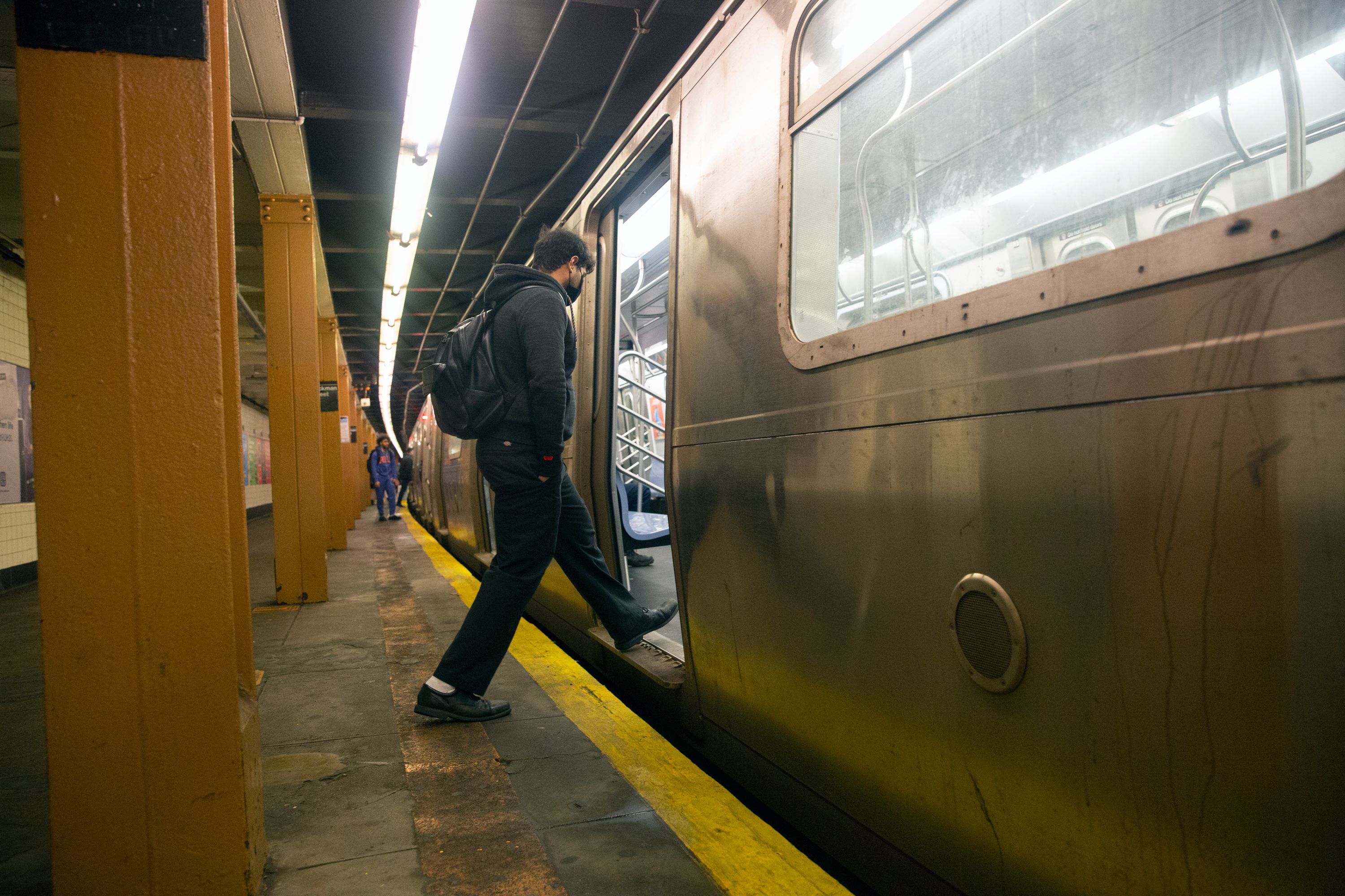 A commuter enters an A train at Dyckman Street in Manhattan, Feb. 23, 2022.