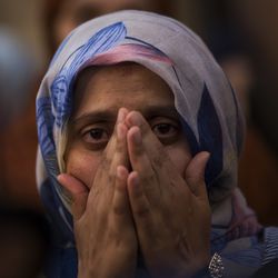 A woman weeps during a gathering of members of the local Muslim community along with relatives of young men believed responsible for the attacks in Barcelona and Cambrils to denounce terrorism and show their grief in Ripoll, north of Barcelona, Spain, Sunday Aug. 20, 2017. (AP Photo/Francisco Seco)