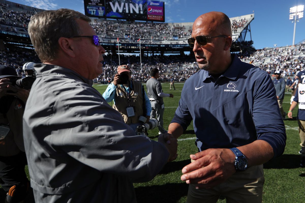 Sep 24, 2022; University Park, Pennsylvania, USA; Penn State Nittany Lions head coach James Franklin (right) shakes hands with Central Michigan Chippewas head coach Jim McElwain (left) following the competition of the game at Beaver Stadium.