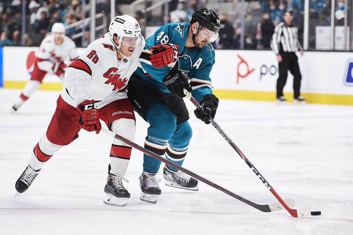 Carolina Hurricanes left wing Teuvo Teravainen (86) and San Jose Sharks center Tomas Hertl (48) fight for the puck during the NHL hockey game between the San Jose Sharks and the Carolina Hurricanes on November 22nd, 2021 at SAP Center in San Jose, CA.