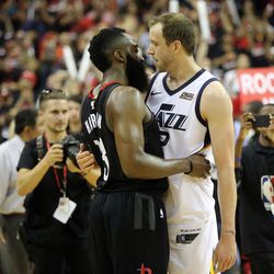 Houston Rockets guard James Harden (13) hugs Utah Jazz forward Joe Ingles (2) after the Jazz lost Game 5 of the NBA playoffs at the Toyota Center in Houston on Tuesday, May 8, 2018. The Jazz lost 102-112.