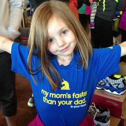 Ali Cowart shows off her swag at a fun run at Wasatch Running Center in Sandy Monday night to remember and raise money for victims of the Boston Marathon bombings. Her mom, Kim Cowart, ran the Boston Marathon last Monday.
