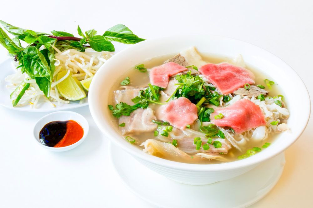Pho topped with rare beef.