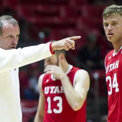 Utah head coach Larry Krystkowiak gives instructions to center Jayce Johnson during the team's season opening showcase, Night with the Runnin' Utes, at the Huntsman Center in Salt Lake City on Tuesday, Oct. 18, 2016. 
