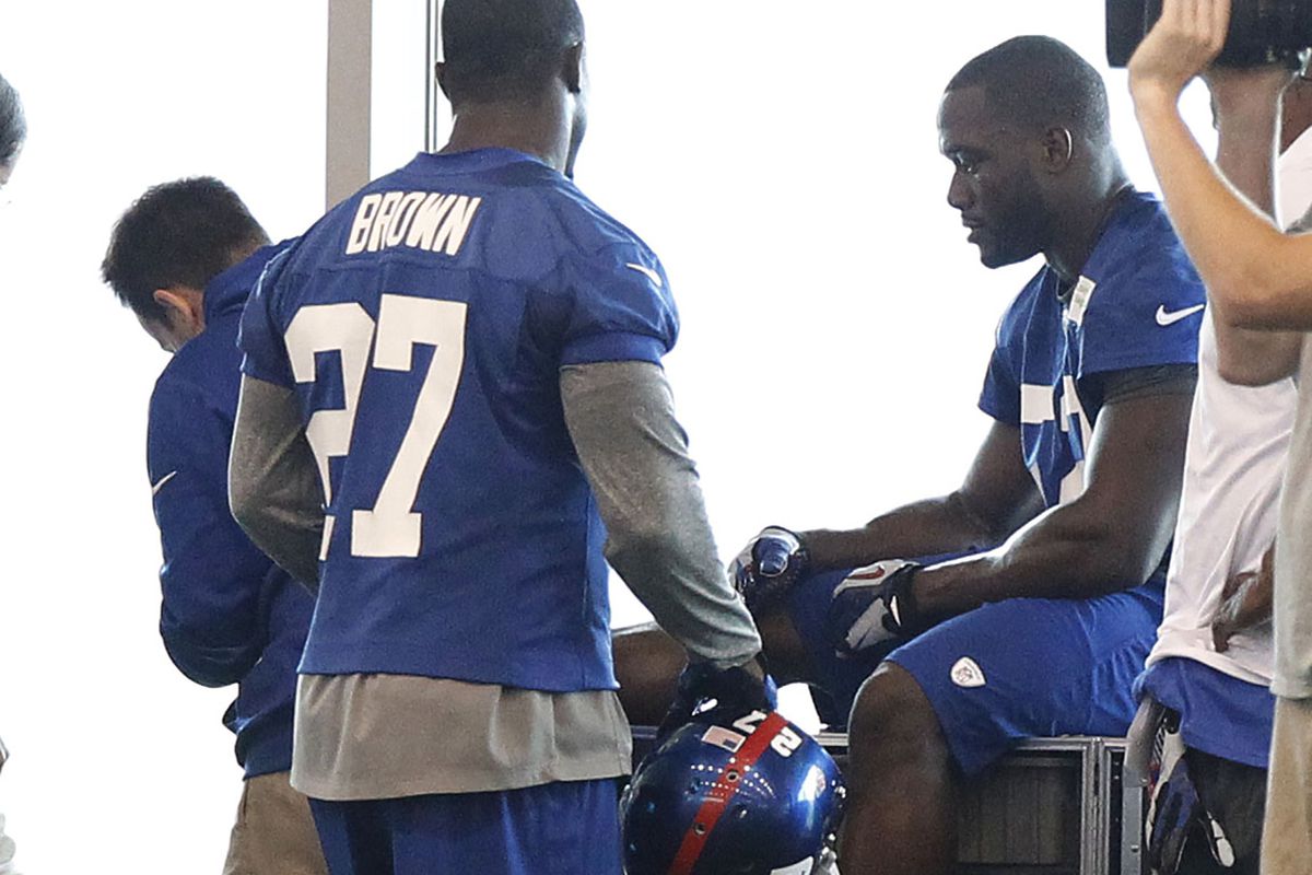 Jon Beason is tended to Thursday after injuring his right foot