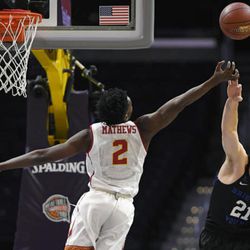 Southern California guard Jonah Mathews, left, and BYU forward Kyle Davis reach for a rebound during the first half of an NCAA college basketball game, Saturday, Dec. 3, 2016, in Los Angeles. (AP Photo/Mark J. Terrill)