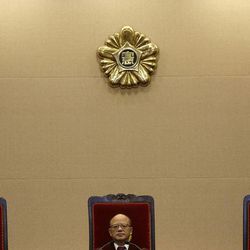 Park Han-chul, center, president of South Korea's Constitutional Court, sits with other judges before the judgment at the Constitutional Court in Seoul, South Korea, Thursday, Feb. 26, 2015. The court on Thursday abolished a 62-year-old law that bans extramarital affairs, ruling that the law suppresses personal freedoms. The ruling by the Constitutional Court could potentially affect thousands of individuals who faced adultery charges since Oct. 31, 2008, a day after the court previously upheld the adultery ban. Current charges could be thrown out and anyone given a guilty verdict would be eligible for a retrial, according to a court official, who didn't want to be named, citing office rules. 
