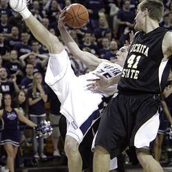 Utah State's Nate Bendall grabs a rebound by Wichita State's Garrett Stutz in NCAA basketball action in Logan, Utah, Sunday, Feb. 21, 2010.  Jeffrey D. Allred, Deseret News