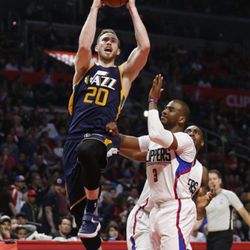 Utah Jazz forward Gordon Hayward goes to the hoop past Los Angeles Clippers guard Chris Paul during the first half of an NBA basketball game, Saturday, March 25, 2017, in Los Angeles. (AP Photo/Danny Moloshok)