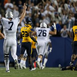 BYU quarterback Taysom Hill celebrates after Cougar running back Jamaal Williams scores a touchdown, making the score 28-28 after the PAT, during a game at LaVell Edwards Stadium in Provo on Friday, Sept. 30, 2016.