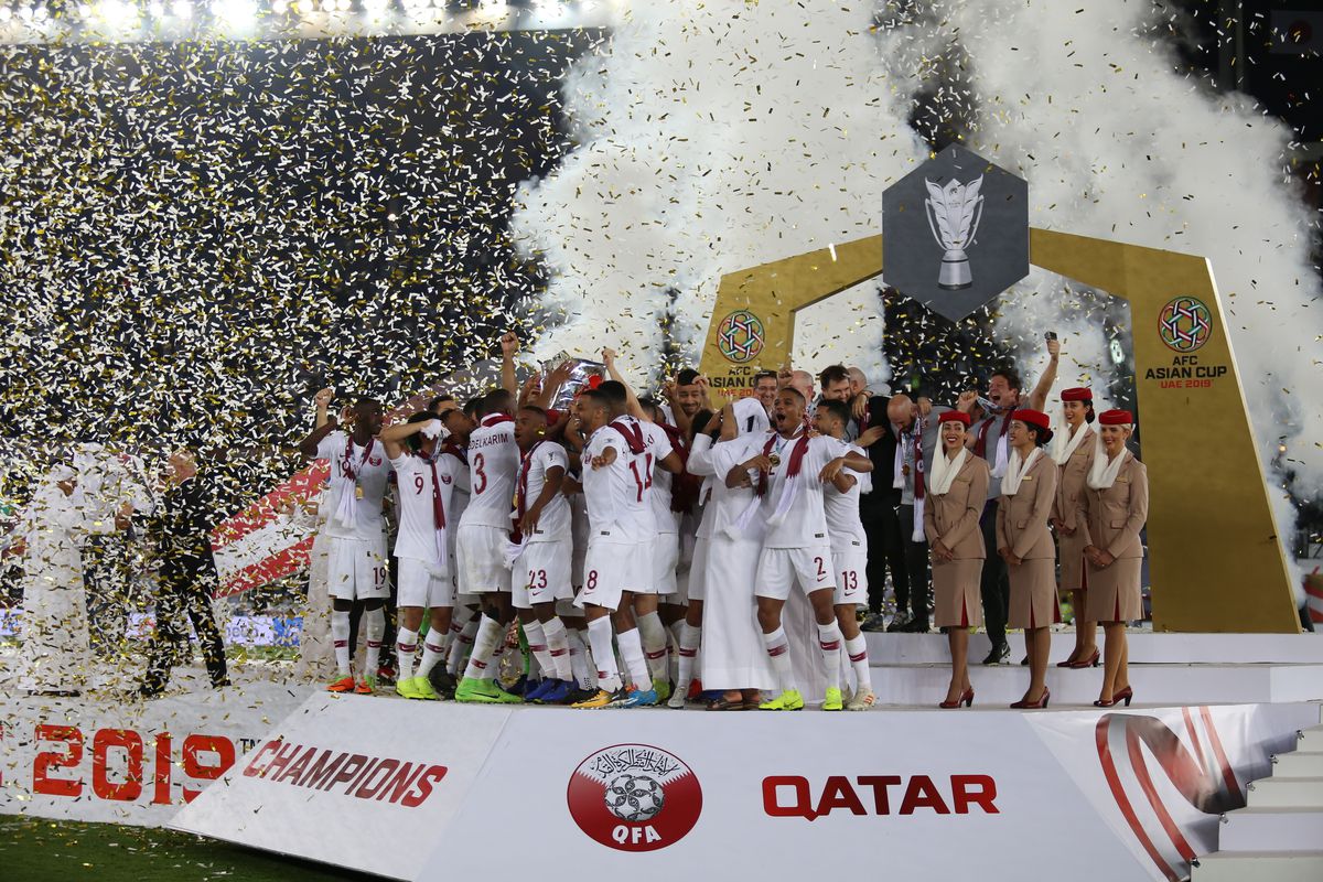 Qatar team players are seen celebrating their win after...
