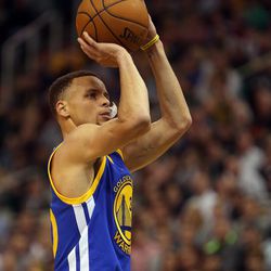 Golden State Warriors guard Stephen Curry shoots a technical free throw in the second half of an NBA regular season game against the Utah Jazz at the Vivint Arena in Salt Lake City, Wednesday, March 30, 2016.