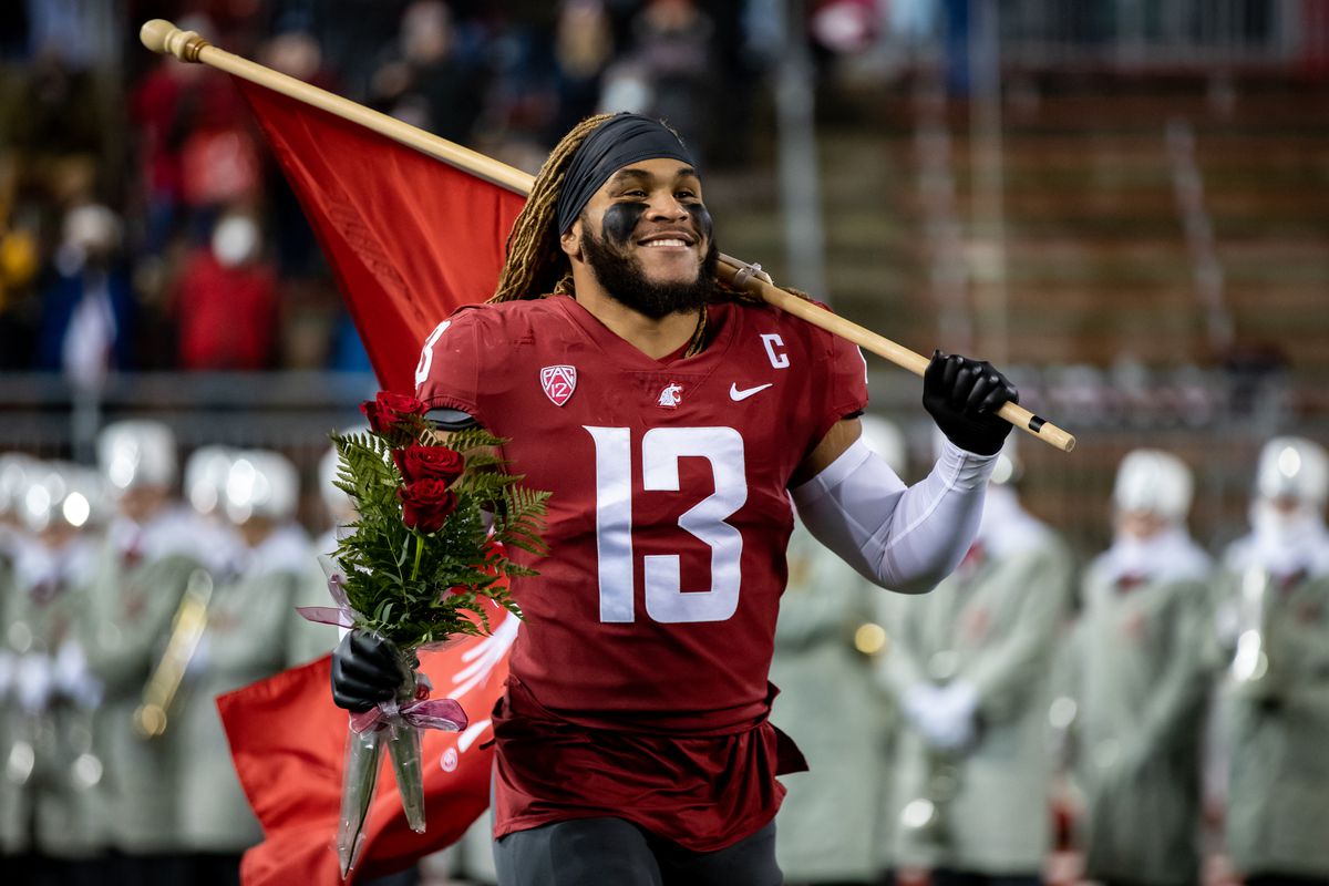 PULLMAN, WA - NOVEMBER 19: Washington State linebacker Jahad Woods (13) runs out of the tunnel on Senior Night prior to a PAC 12 conference matchup between the Arizona Wildcats and the Washington State Cougars on November 19, 2021, at Martin Stadium in Pullman, WA.