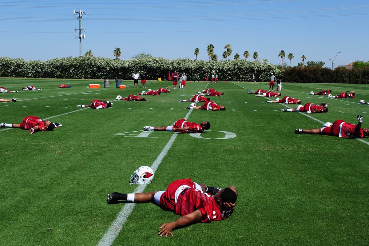 May 11, 2012; Tempe, AZ, USA; Arizona Cardinals players stretch on the field during rookie mini camp at the Cardinals practice facility.  Mandatory Credit: Mark J. Rebilas-US PRESSWIRE