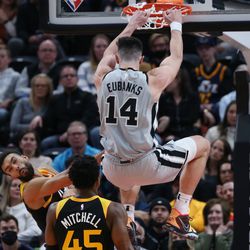San Antonio Spurs forward Drew Eubanks (14) dunks over Utah Jazz center Rudy Gobert (27) at Vivint Arena in Salt Lake City on Friday, Dec. 17, 2021. The Spurs won 128-126.