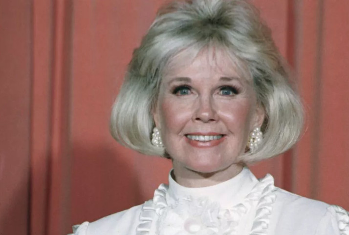 In this Jan. 28, 1989 file photo, actress and animal rights activist Doris Day poses for photos after receiving the Cecil B. DeMille Award she was presented with at the annual Golden Globe Awards ceremony in Los Angeles. Day, whose wholesome screen presence stood for a time of innocence in ‘60s films, has died, her foundation says. She was 97. The Doris Day Animal Foundation confirmed Day died early Monday, May 13, 2019, at her Carmel Valley, California, home. (AP Photo, File)