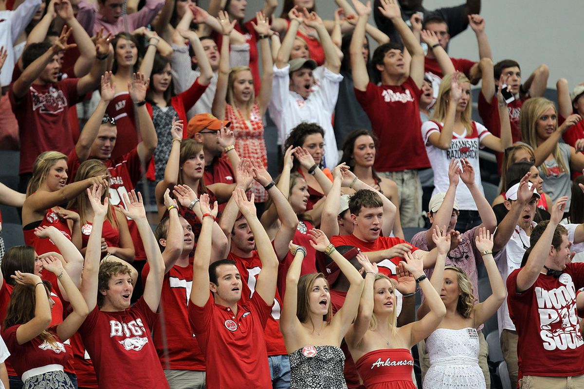 ARLINGTON, TX - OCTOBER 01:  Fans of the Arkansas Razorbacks cheer during play against the Texas A&M Aggies at Cowboys Stadium on October 1, 2011 in Arlington, Texas.  (Photo by Ronald Martinez/Getty Images)