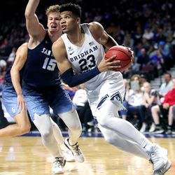 Brigham Young Cougars forward Yoeli Childs (23) drives around San Diego Toreros forward Alex Floresca (15) as the BYU Cougars and San Diego Toreros play in WCC tournament action at the Orleans Arena in Las Vegas on Saturday, March 9, 2019.