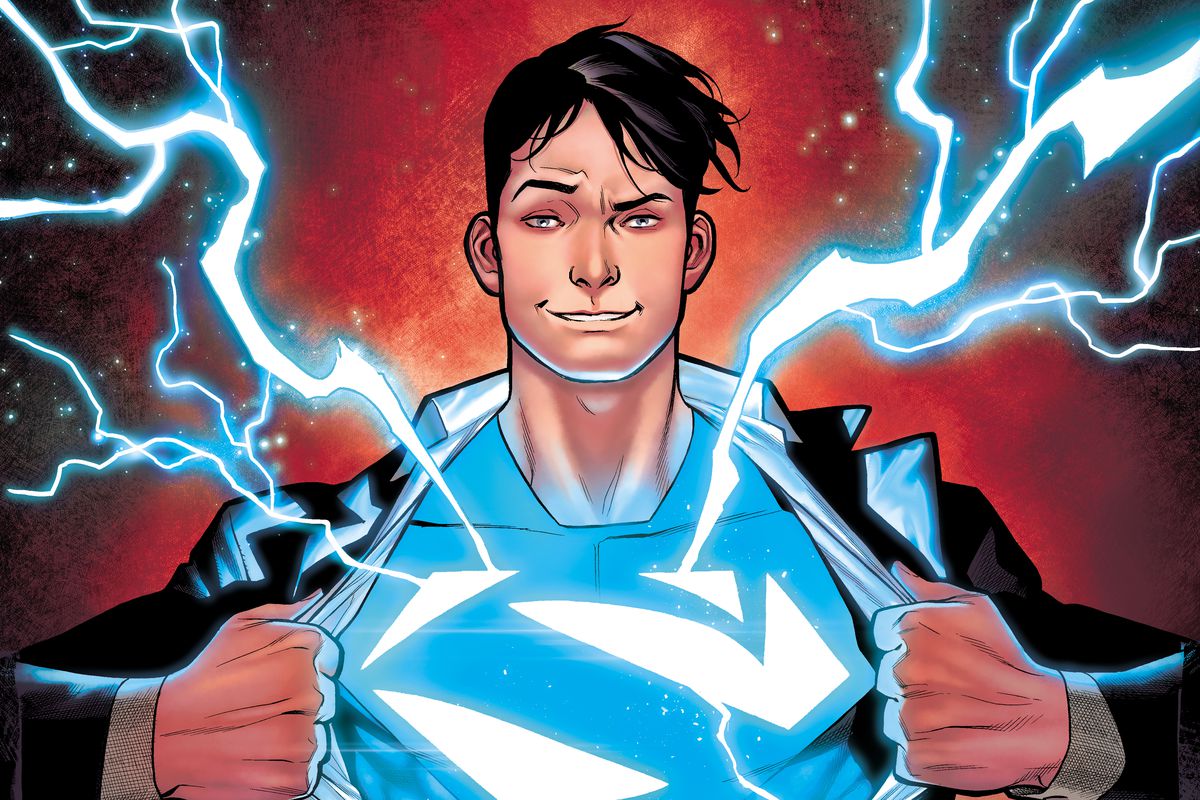 Jon Kent/Superman pulls open his jacket to reveal a blue Superman symbol with electricity arcing off of it on the cover of Adventures of Superman: Jon Kent #1 (2023). 