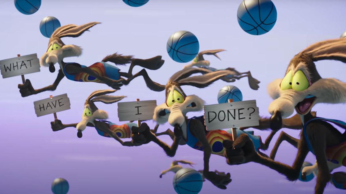 Several copies of Wile E. Coyote hurdle through the air together, along with several basketballs, holding up signs that say “What have I done?” in this image from Space Jam: A New Legacy