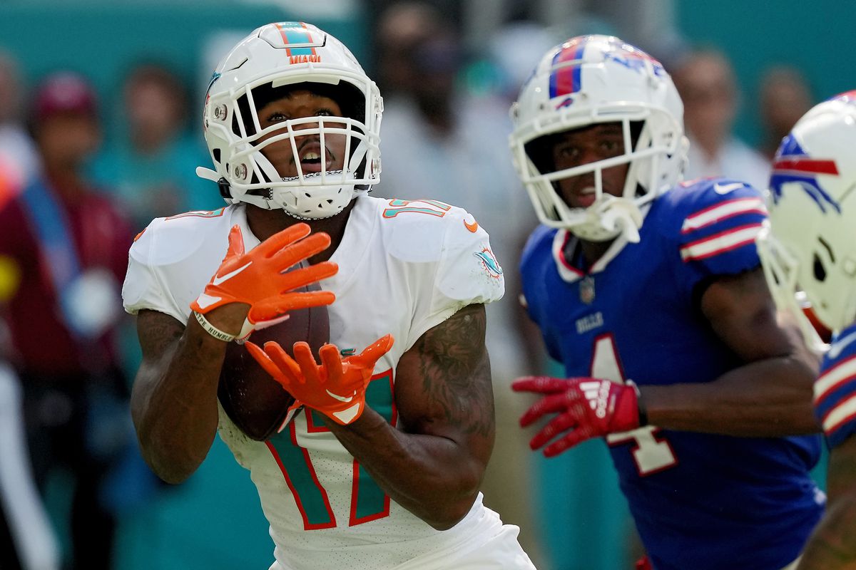 Wide receiver Jaylen Waddle #17 of the Miami Dolphins catches the ball as safety Jaquan Johnson #4 of the Buffalo Bills defends in the third quarter of the game at Hard Rock Stadium on September 25, 2022 in Miami Gardens, Florida.