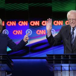 Democratic presidential candidate, Hillary Clinton argues a point as Sen. Bernie Sanders, I-Vt., right, reacts during a Democratic presidential primary debate at the University of Michigan-Flint, Sunday, March 6, 2016, in Flint, Mich. 
