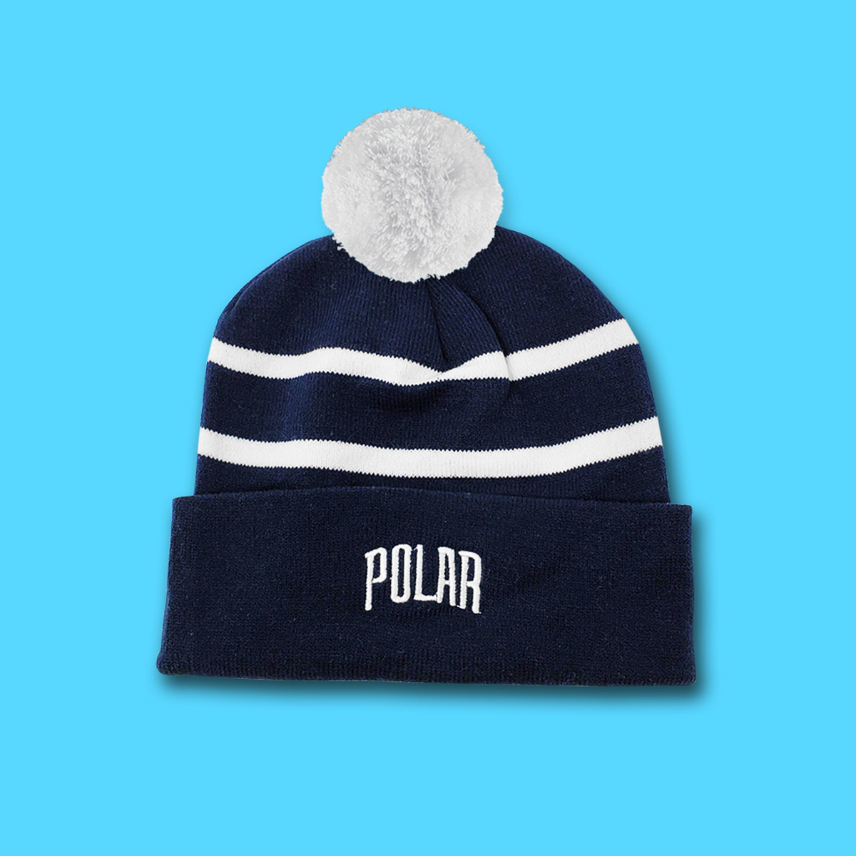 Navy blue and white striped winter hat with white pompom and embroidered Polar logo