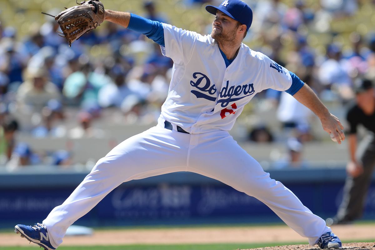 Daniel Coulombe pitches for the Los Angeles Dodgers against the New York Mets in July.