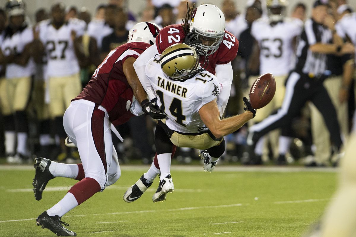 Eddie Elder puts a hit on Andy Tanner of the Saints (Photo by Jason Miller/Getty Images)