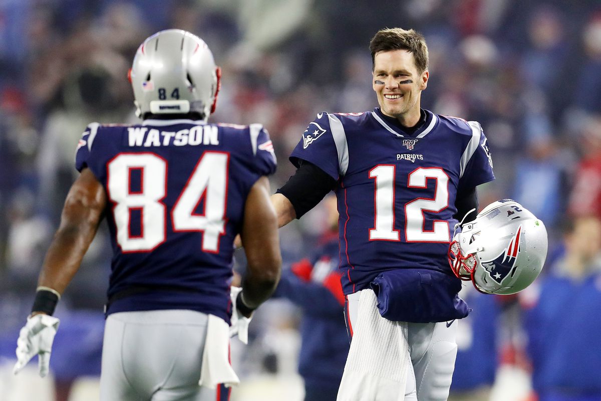 &nbsp;Benjamin Watson #84 of the New England Patriots and teammate Tom Brady #12 show camaraderie before taking on the Tennessee Titans in the AFC Wild Card Playoff game at Gillette Stadium on January 04, 2020 in Foxborough, Massachusetts.