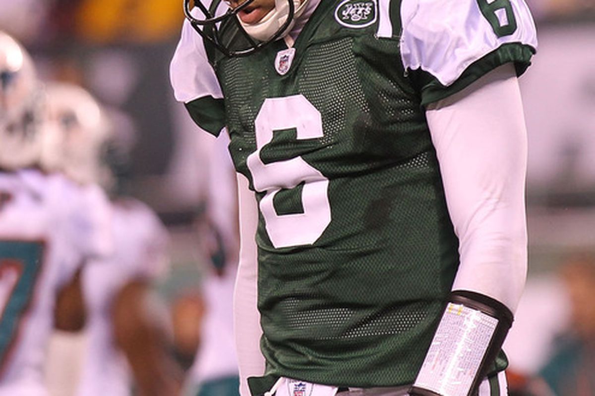 Mark Sanchez (6 )of the New York Jets walks from the field after failing to convert a fourth down against the Miami Dolphins at New Meadowlands Stadium on December 12 2010 in East Rutherford New Jersey.  (Photo by Nick Laham/Getty Images)