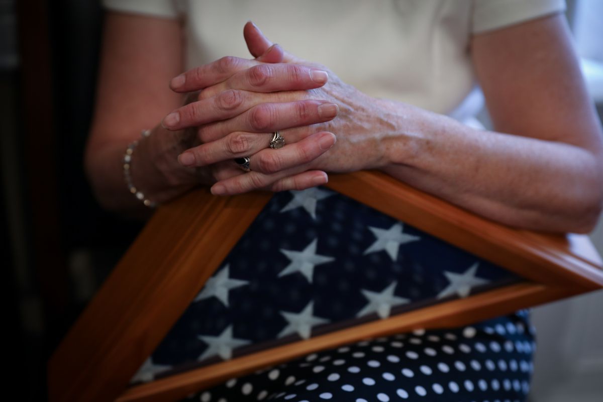 Tamara Taylor, mother of former North Ogden mayor and major in the U.S. Army National Guard Brent Taylor who was killed in Afghanistan in November 2018, holds the U.S. flag gifted to her family to honor her late son during a reception given by Rep. Rob Bi