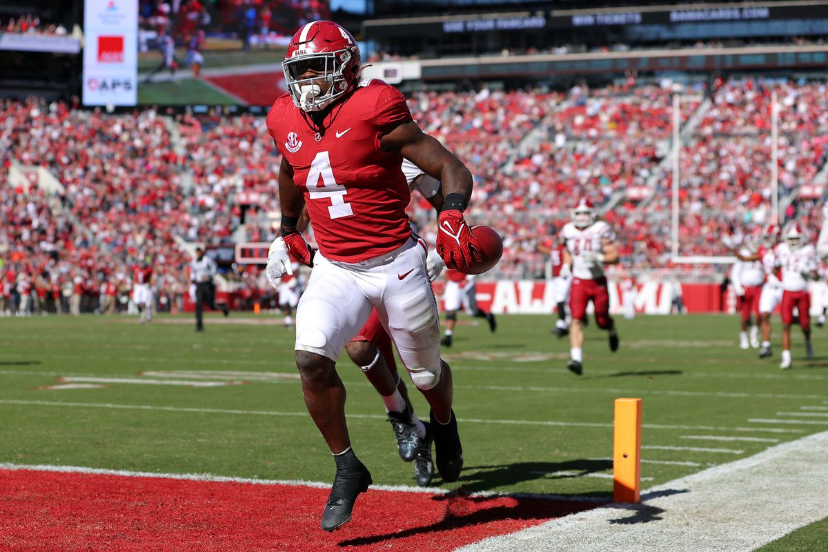 Brian Robinson Jr. of the Alabama Crimson Tide runs into the end zone for a touchdown against the New Mexico State Aggies during the second quarter in the game at Bryant-Denny Stadium on November 13, 2021 in Tuscaloosa, Alabama.