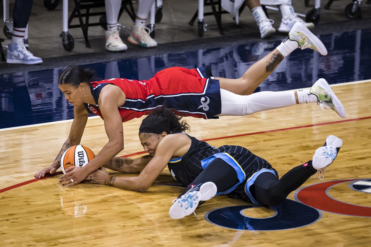 The Sky’s Candace Parker dives for a loose ball against the Mystics’ Natasha Cloud on Saturday. 