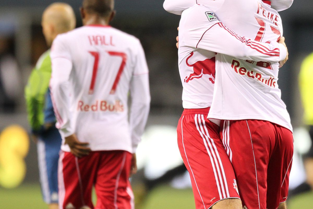 SEATTLE - APRIL 03:  Tim Ream #5 (L) of the New York Red Bulls hugs Mike Petke #12 after defeating the Seattle Sounders FC 1-0 on April 3, 2010 at Qwest Field in Seattle, Washington. (Photo by Otto Greule Jr/Getty Images)