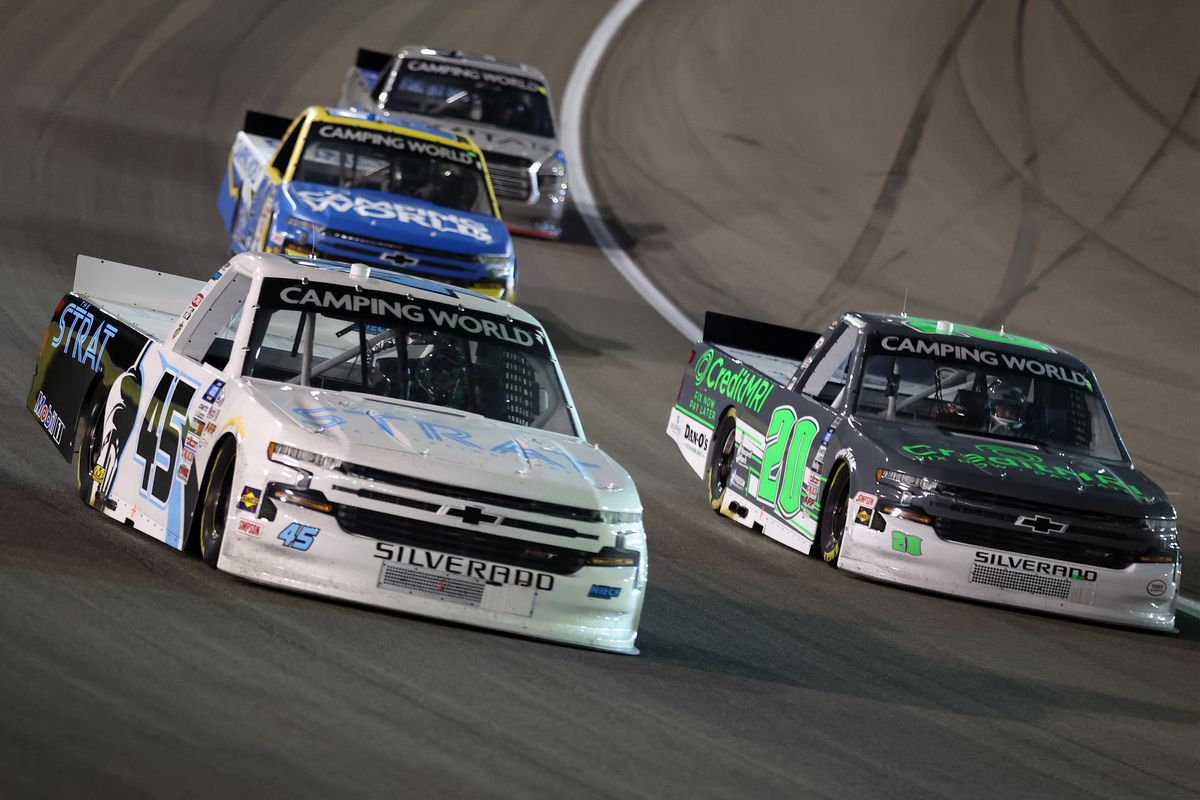 Brett Moffitt, driver of the #45 The Strat Chevrolet, and Spencer Boyd, driver of the #20 Credit MRI Chevrolet, race during the NASCAR Camping World Truck Series Bucked Up 200 at The Bullring at Las Vegas Motor Speedway on March 05, 2021 in Las Vegas, Nevada.