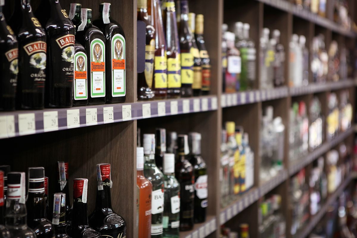 Shelves full of bottles of alcohol in a liquor store