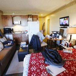 Patient Dan Watson sits in his room as University of Utah Health Care's new Patient and Family Housing Hotel is opened in Salt Lake City Wednesday, Nov. 26, 2014. The new lodging accommodations give patients the options of a long-term suite or guest room for them or their family.