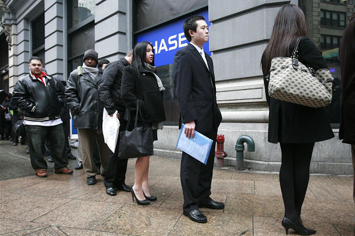 Tan Ruihan, second from right, who recently received a Masters of Finance from Boston University, waits in a line to enter a job fair, Feb. 24, 2010 in New York.