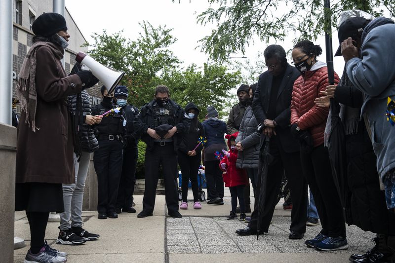 Dozens join 18th District Chicago police officers for a “faith walk” on the Near North Side, Friday evening, May 28, 2021. 