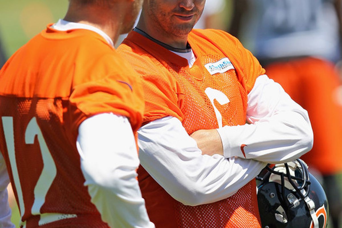 LAKE FOREST, IL - JUNE 12: Jay Cutler #6 of the Chicago Bears talks with Josh McCowen #12 during a minicamp practice at Halas Hall on June 12, 2012 in Lake Forest, Illinois. (Photo by Jonathan Daniel/Getty Images)