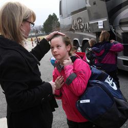 Lynette Baird talks to her daughter, Shayla, as she meets her after school at Sunrise Elementary School in Sandy on Friday, Dec. 14, 2012. Shayla was going to Snowbird for after-school skiing.