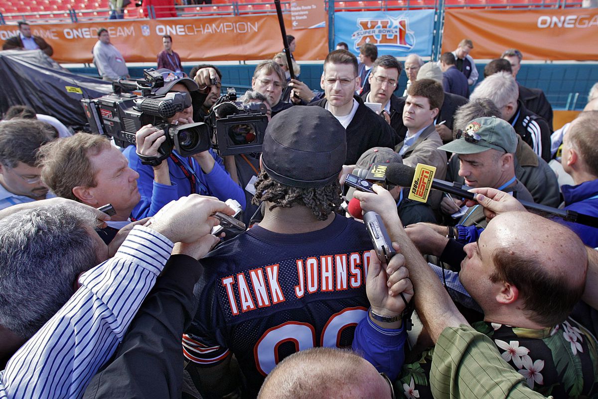 Chicago Bears’ Tank Johnson chats with the press during Medi