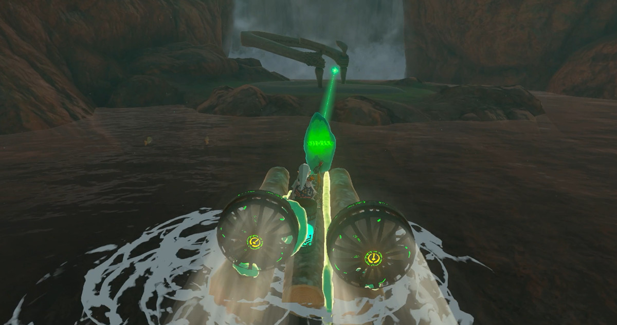 Link stands on a raft moving toward a shrine. The crystal’s light shows the way.