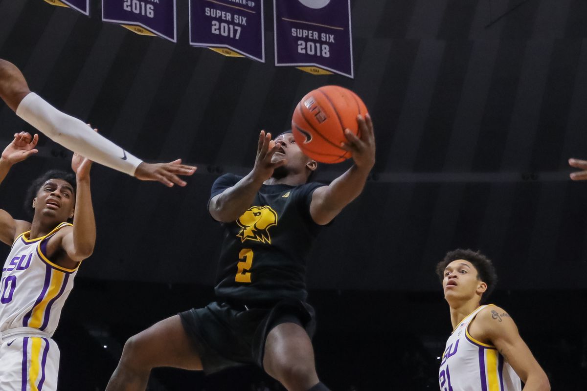UMBC Retrievers guard Darnell Rogers drives to the basket against LSU Tigers defense during the second half at Maravich Assembly Center.
